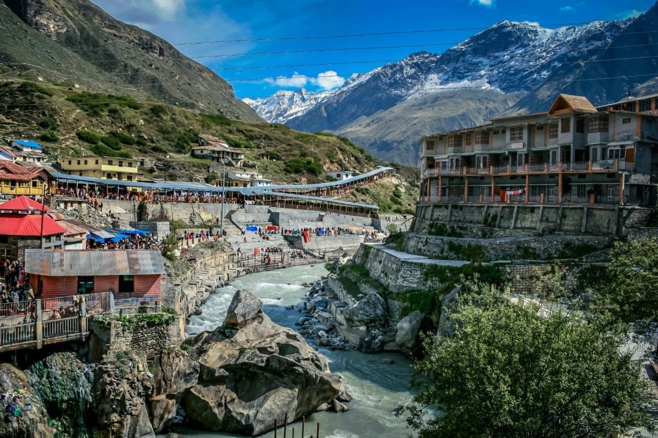 Badrinath town and the Alaknanda River with snow-capped Himalayan peaks in the background